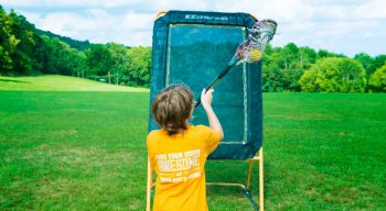 Camper playing lacrosse