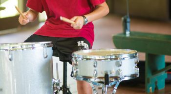 Airy camper playing drums