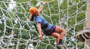 Camper on ropes course