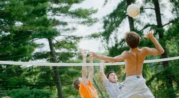 Campers playing volleyball